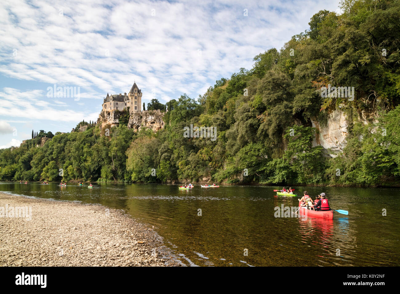 Canoeists on the Dordogne River Below the Chateau de Montfort, Dordogne, Aquitaine, France, Europe Stock Photo