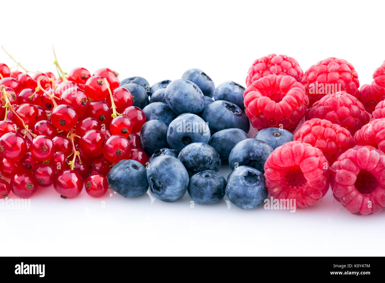 raspberry, blueberry, currant, different berries isolated on white