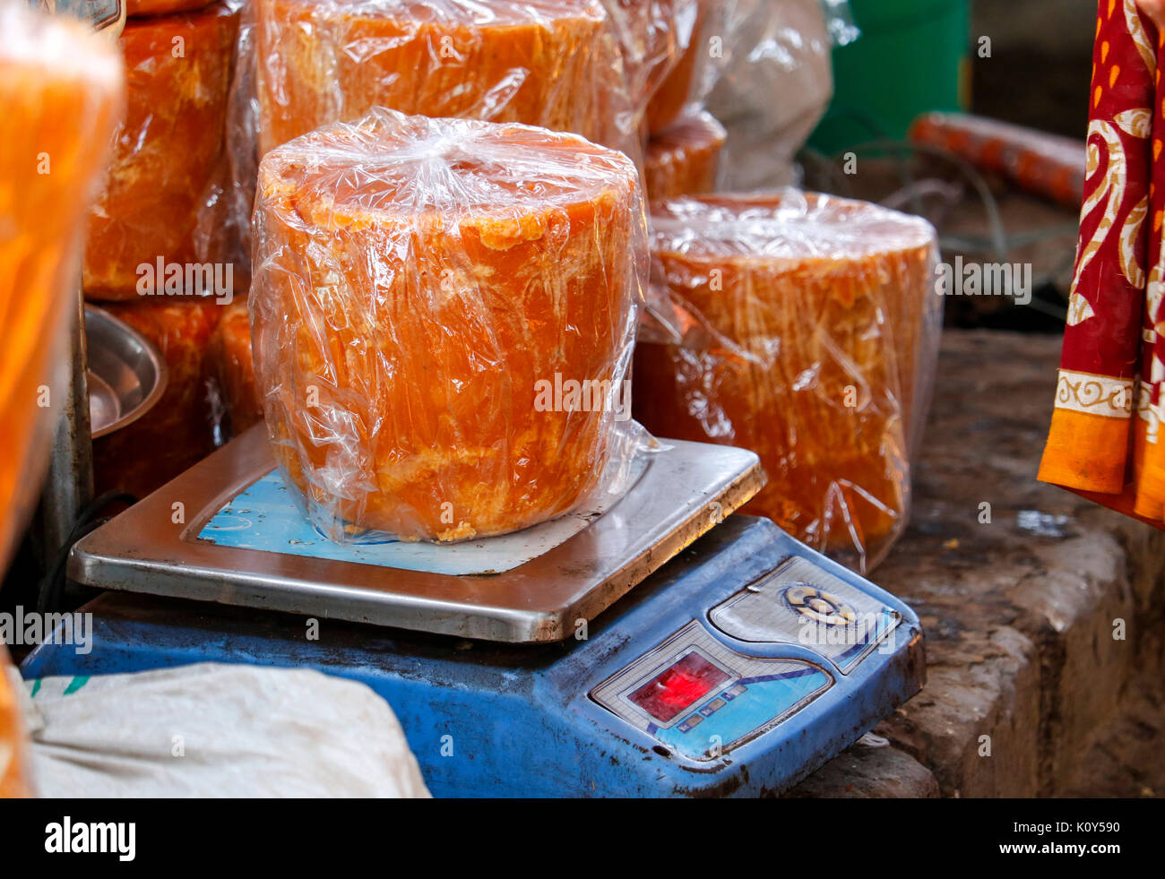 Jaggery being weighed for transport Stock Photo
