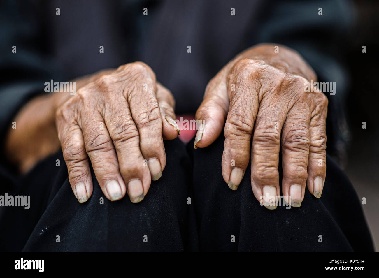 Bulang ethnic minoriy oldwoman, hands Xishuangbanna, Yunnan, China Stock Photo