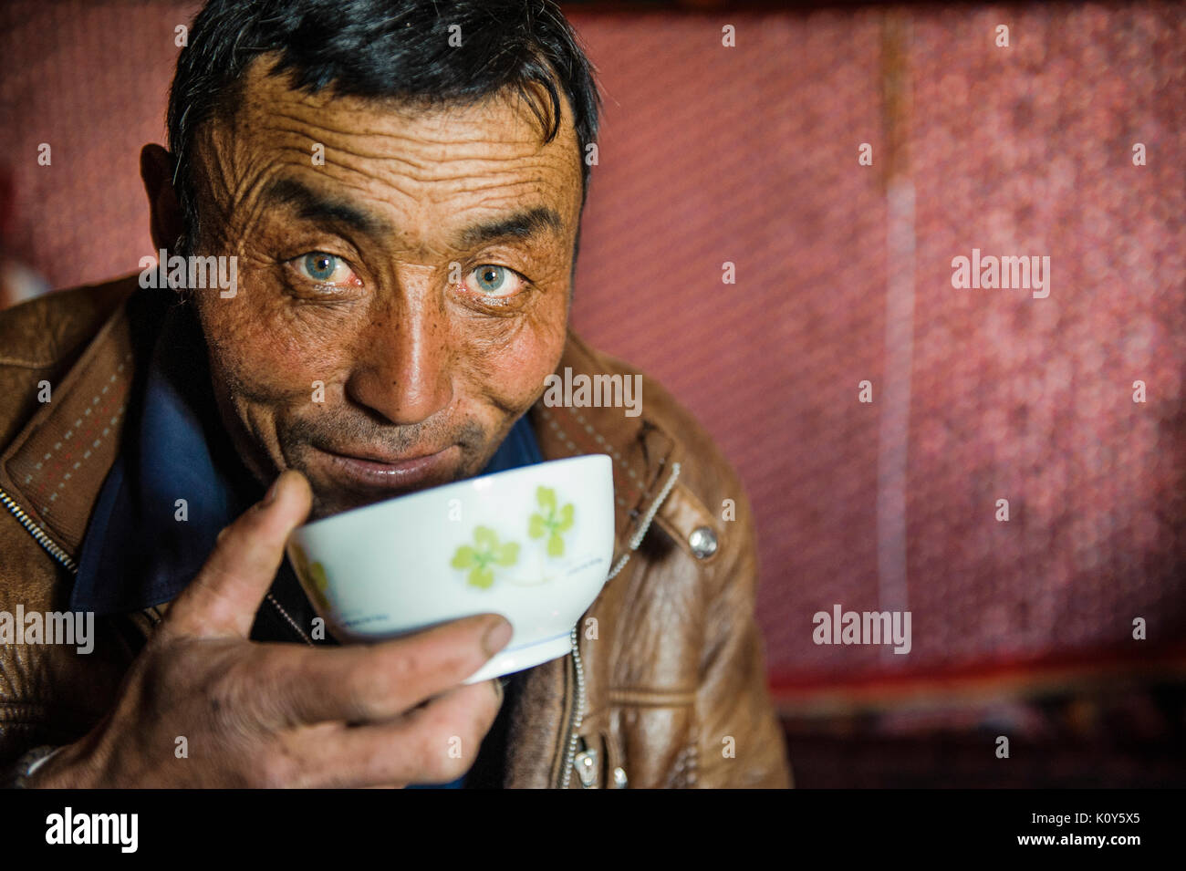 A Green-eyed Uighur Man Resting And Having Lunch At Noon In Remote 