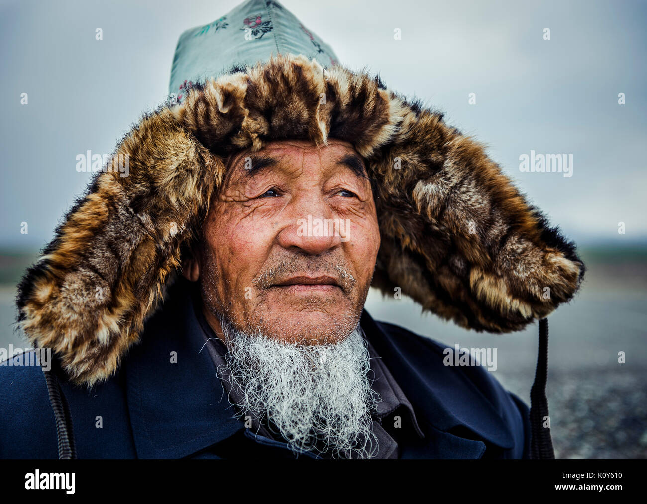 A Mongolian man wearing a traditional hat. Xinjiang Stock Photo