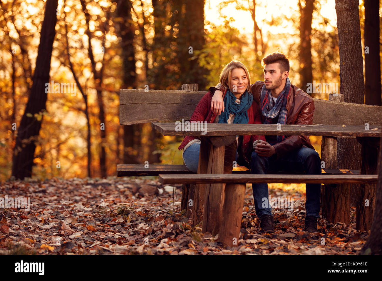 love in the autumn park- Romantic couple on bench Stock Photo - Alamy