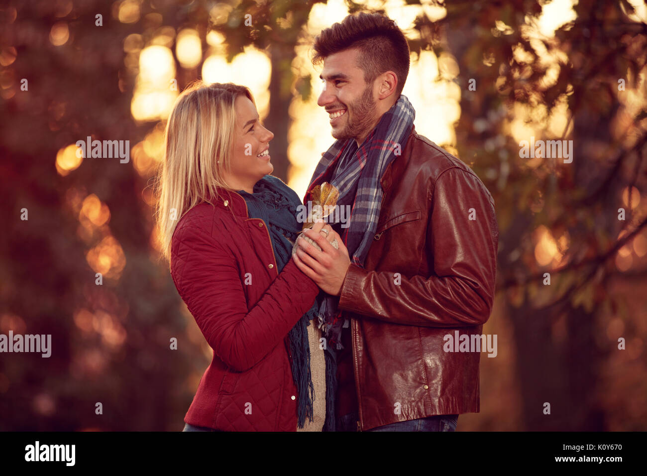 smiling couple enjoying in time at autumn park Stock Photo - Alamy
