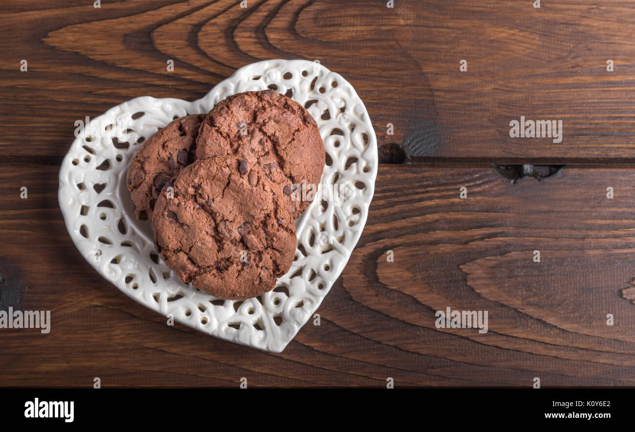 chocolate cookies on a heart shaped plate Stock Photo