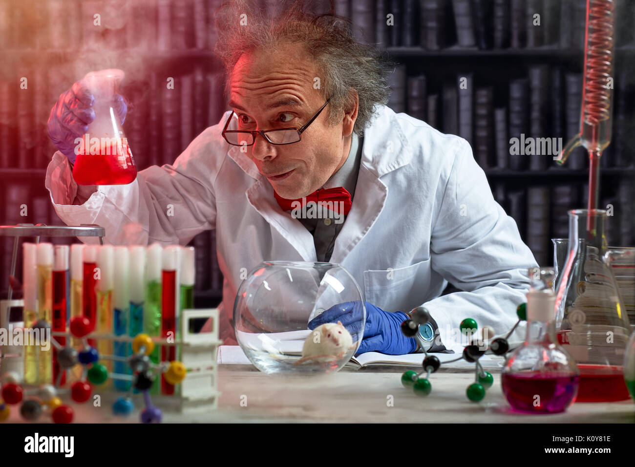 crazy scientist the making mix of chemicals to experiment on mouse Stock Photo
