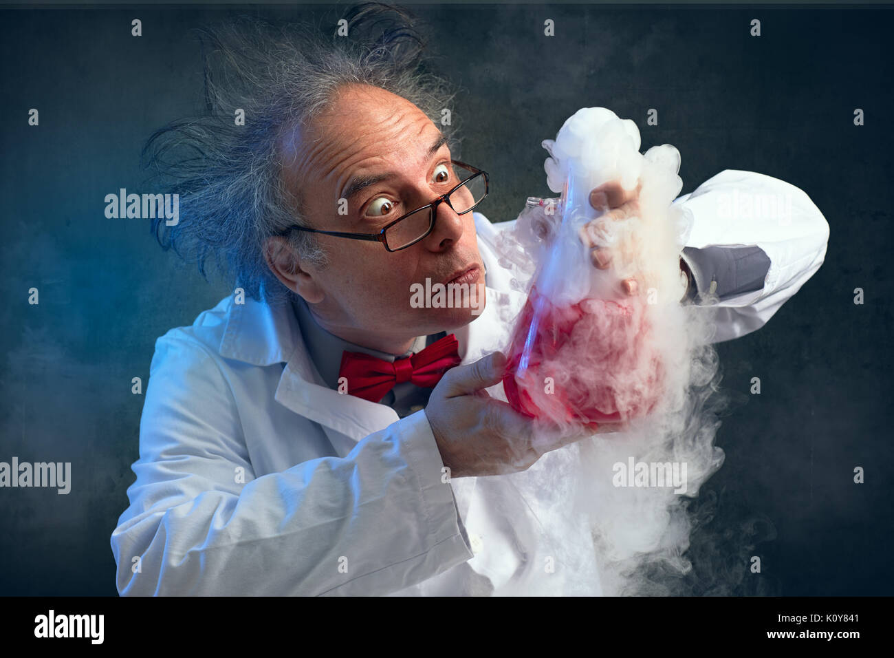 chemist crazy about his experiment smell his experiment Stock Photo