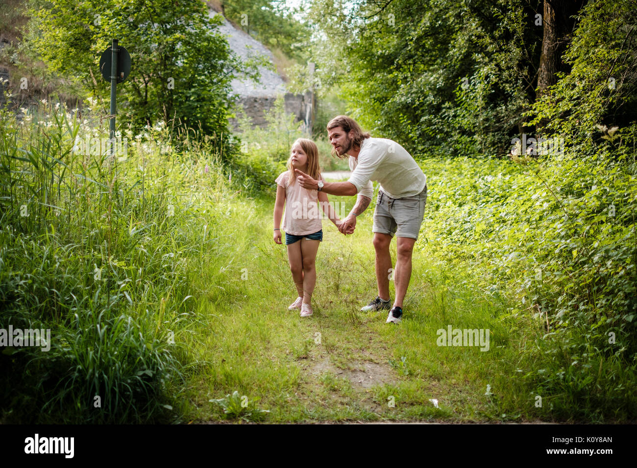 Father and daughter together in the forest Stock Photo - Alamy