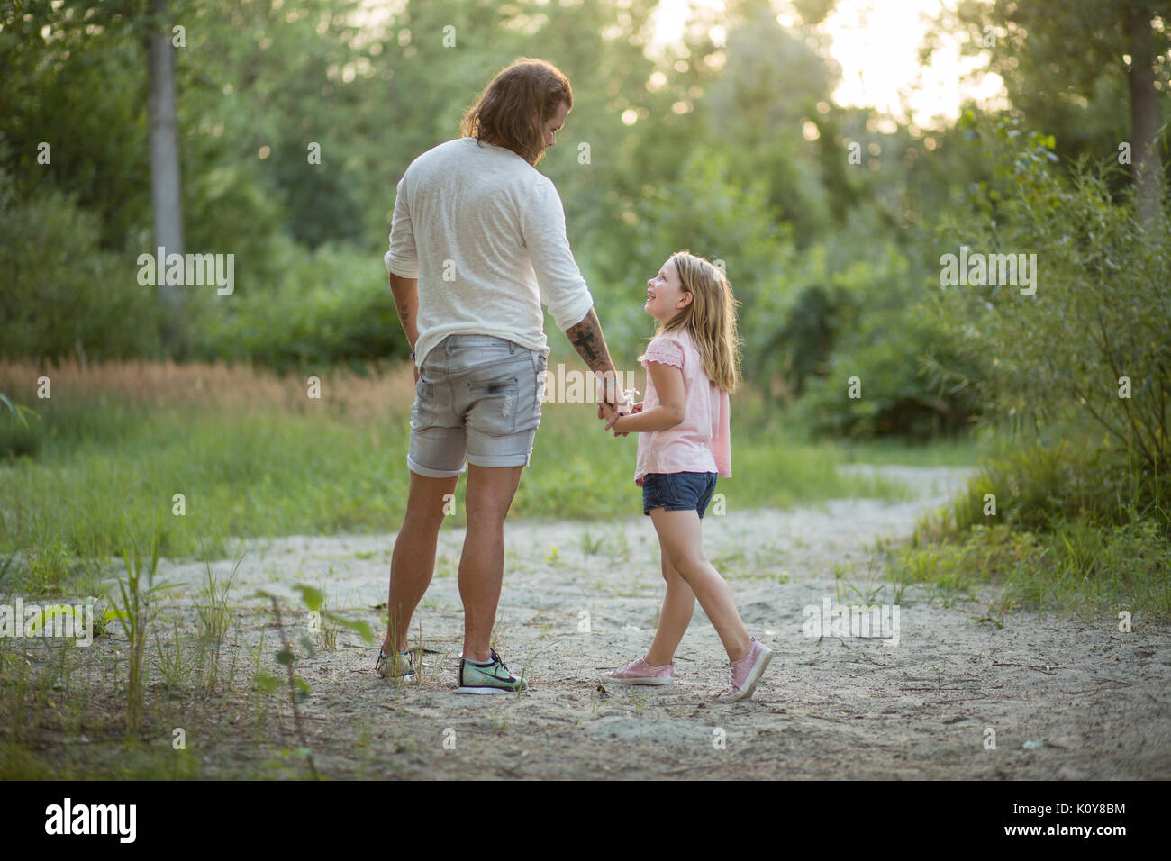 Father and daughter together in the forest Stock Photo - Alamy
