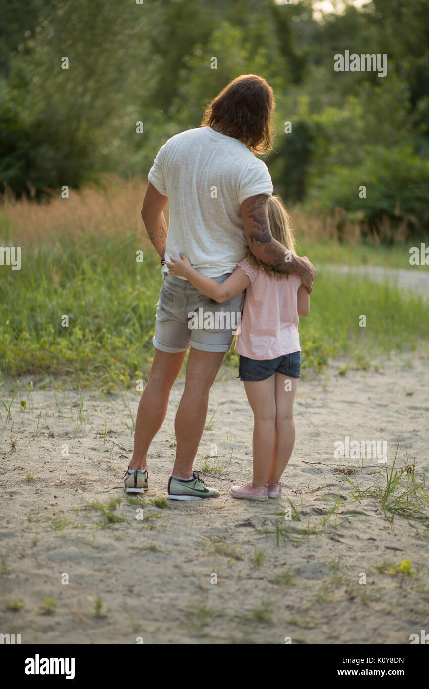Father and daughter together in the forest Stock Photo - Alamy