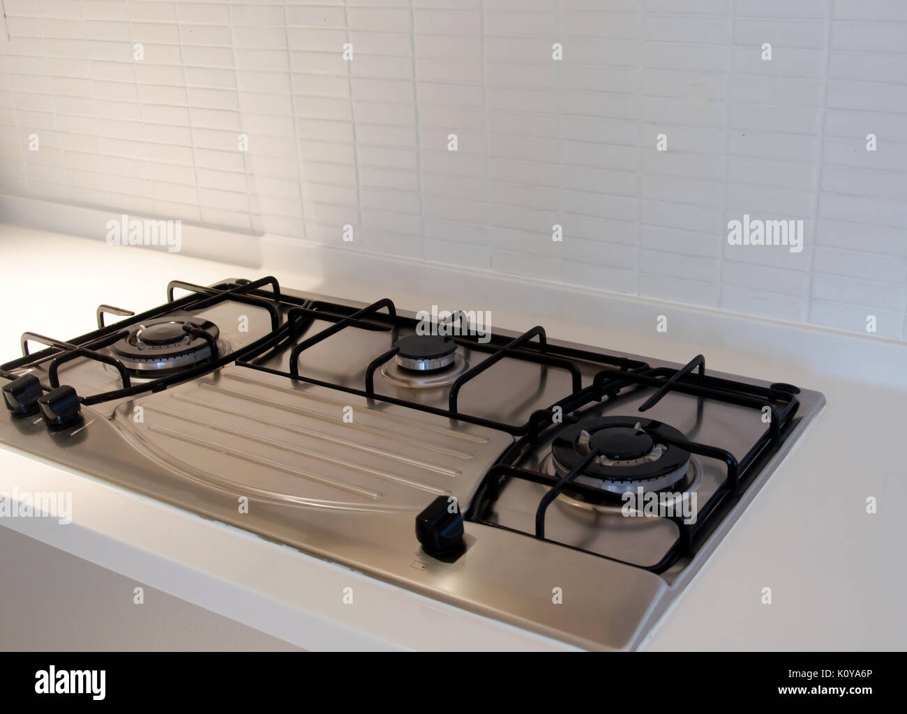 Cooking on a modern design gas stove burner Stock Photo - Alamy