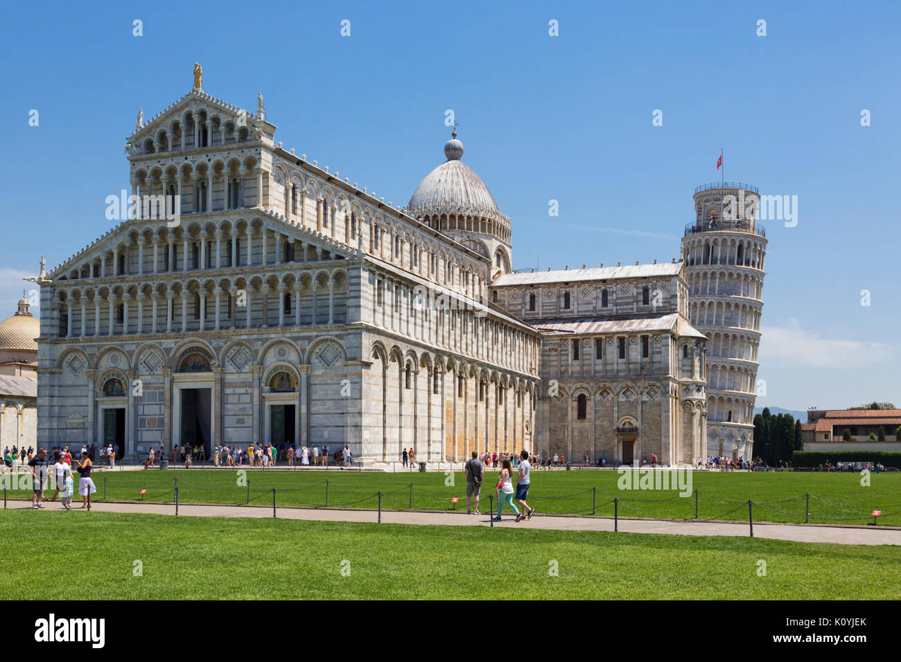 Pisa, Pisa Province, Tuscany, Italy.  Campo dei Miracoli, or Field of Miracles.  Also known as the Piazza del Duomo.  The cathedral, or Duomo, and its Stock Photo