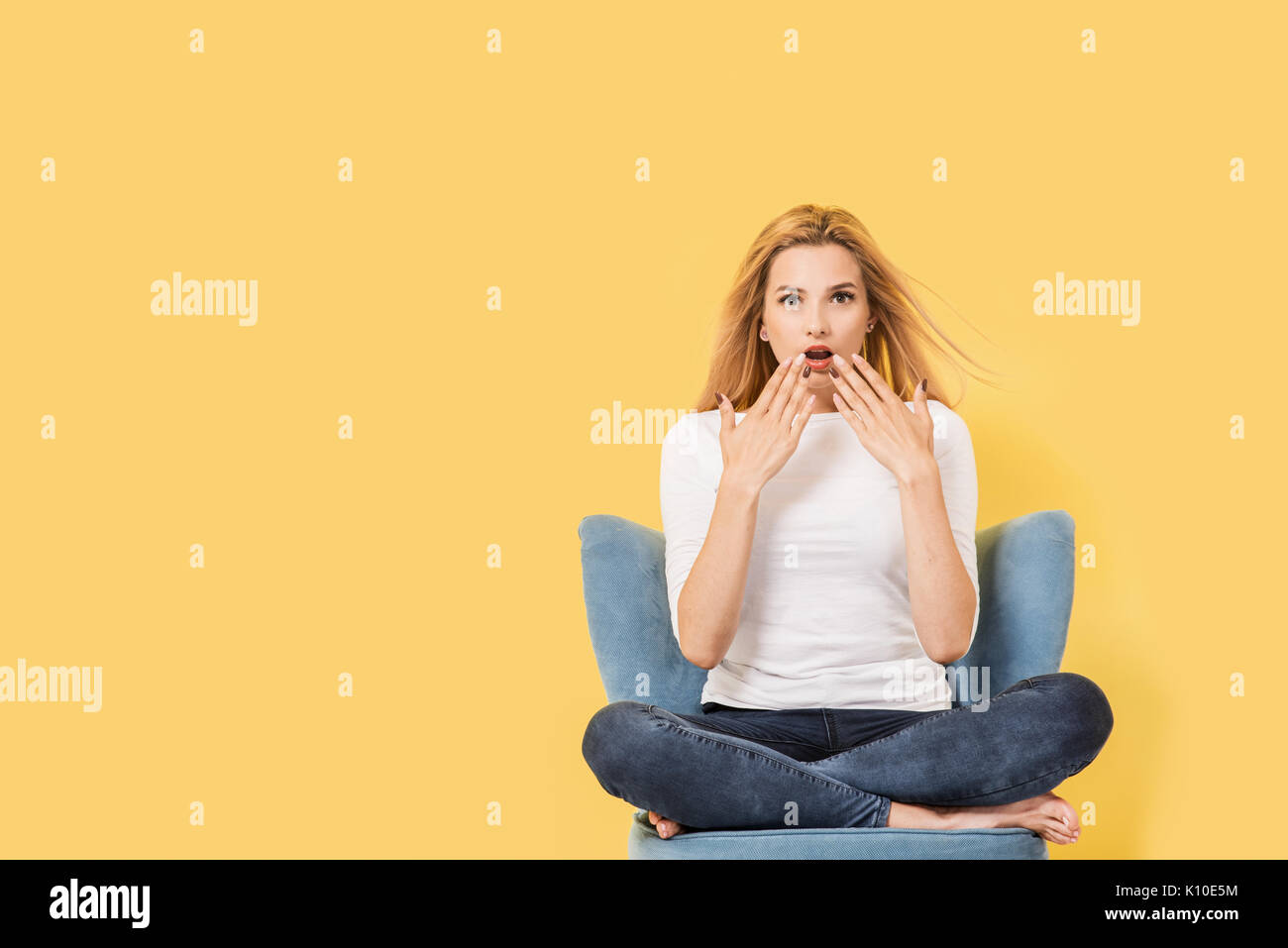 Surprised young blonde woman hi-res stock photography and images - Alamy