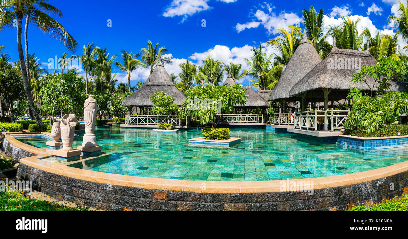 Luxury resort spa territory with gorgeous swim pool in Mauritius island. Tropical vacation consept Stock Photo
