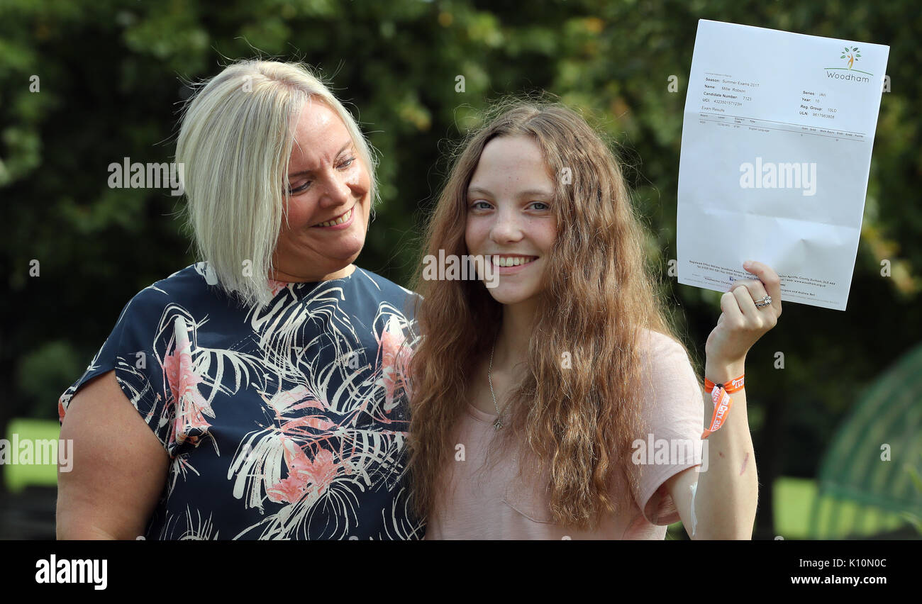 Millie Robson, 15, who was injured in the Manchester Bombings celebrates taking her GCSE English a year early, with her mother Marie, 43, at Woodham Academy in Newton Ayrcliffe. Stock Photo