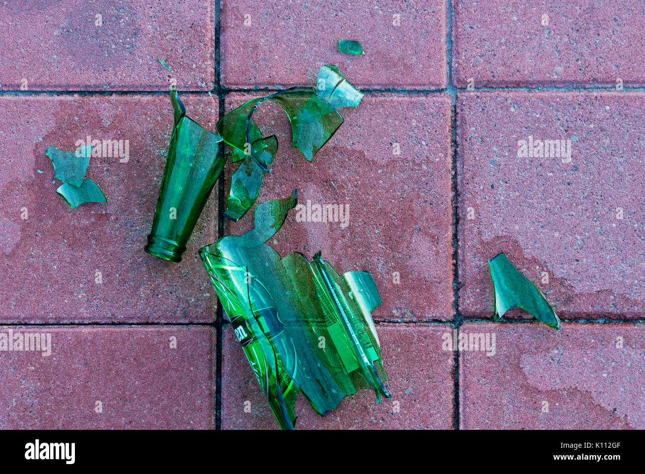 Dangerous shards of glass. Broken bottle on the sidewalk Stock Photo Alamy