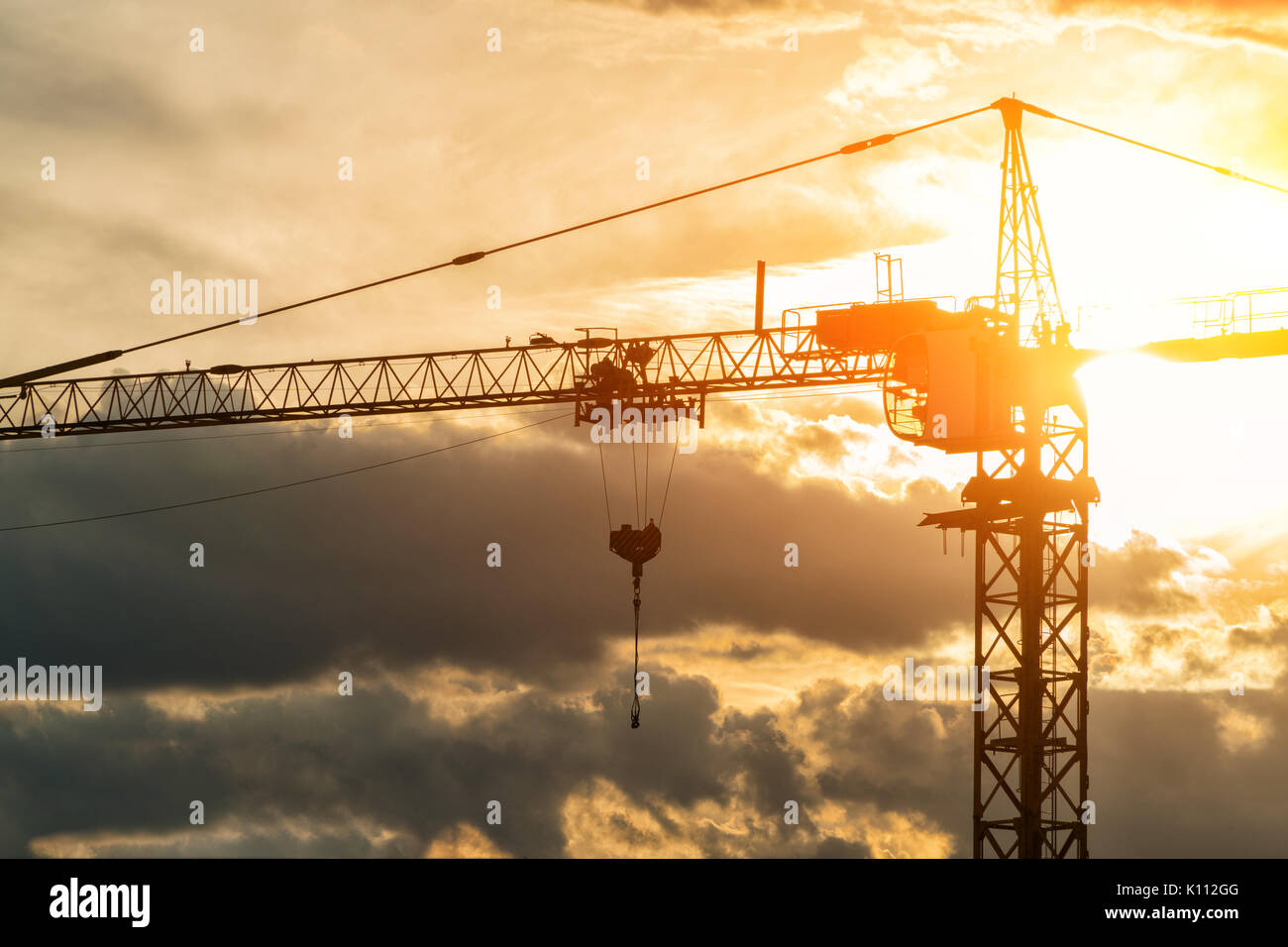 silhouette of construction crane on sunset sky background Stock Photo ...