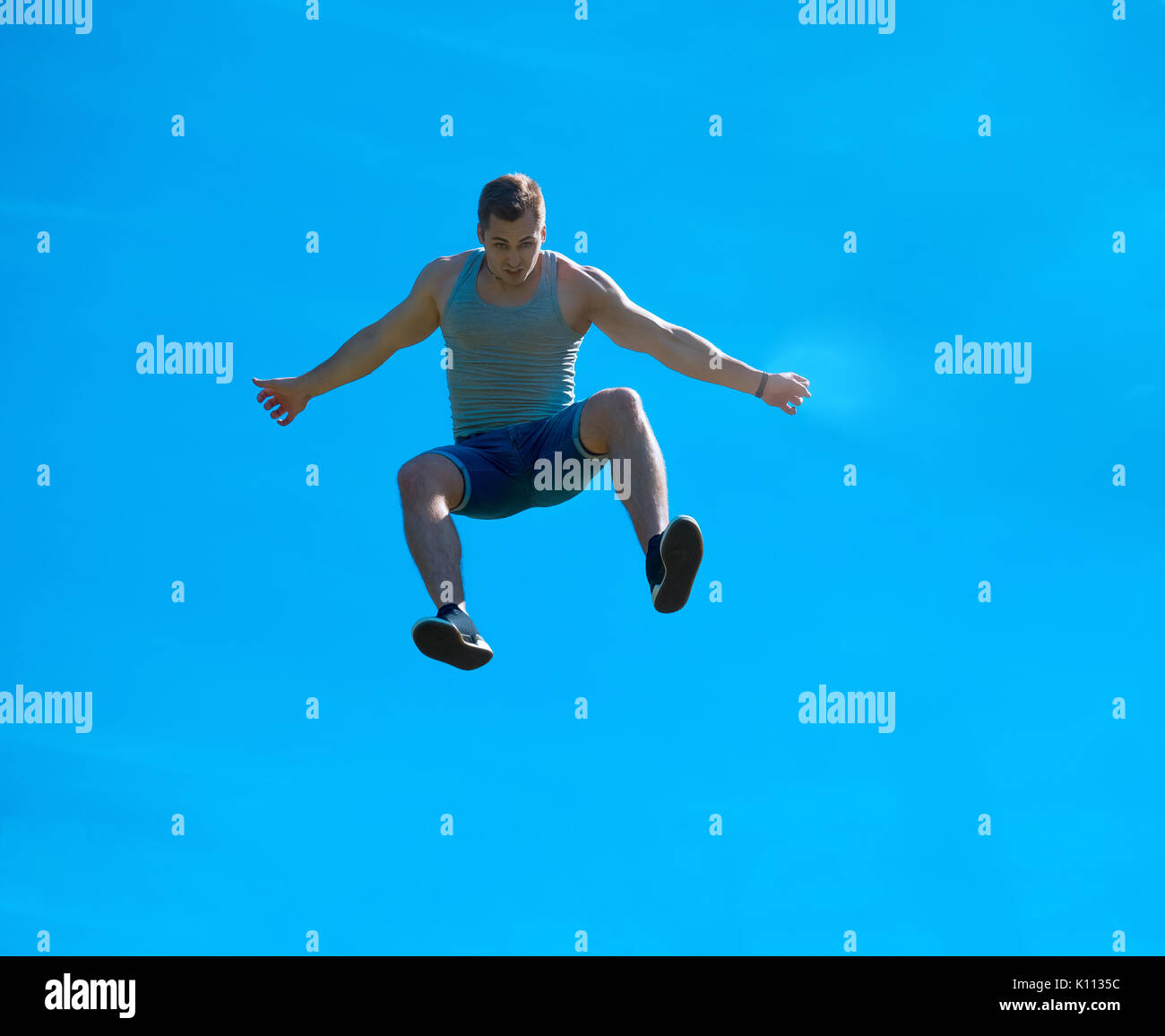 Man Jump Fall Jumping up guy. Background blue sky. Free fall Stock Photo - Alamy