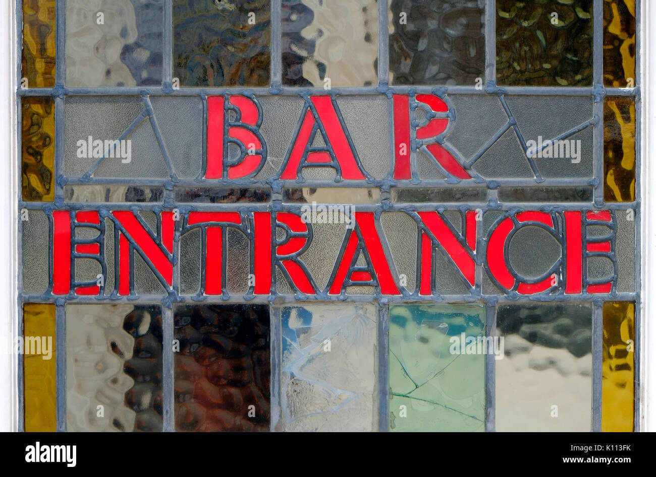 bar entrance sign in vintage glass pub door Stock Photo