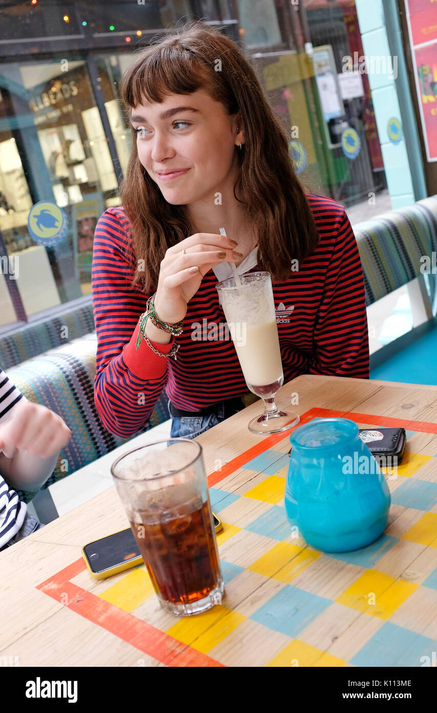 young teenage female in cafe Stock Photo