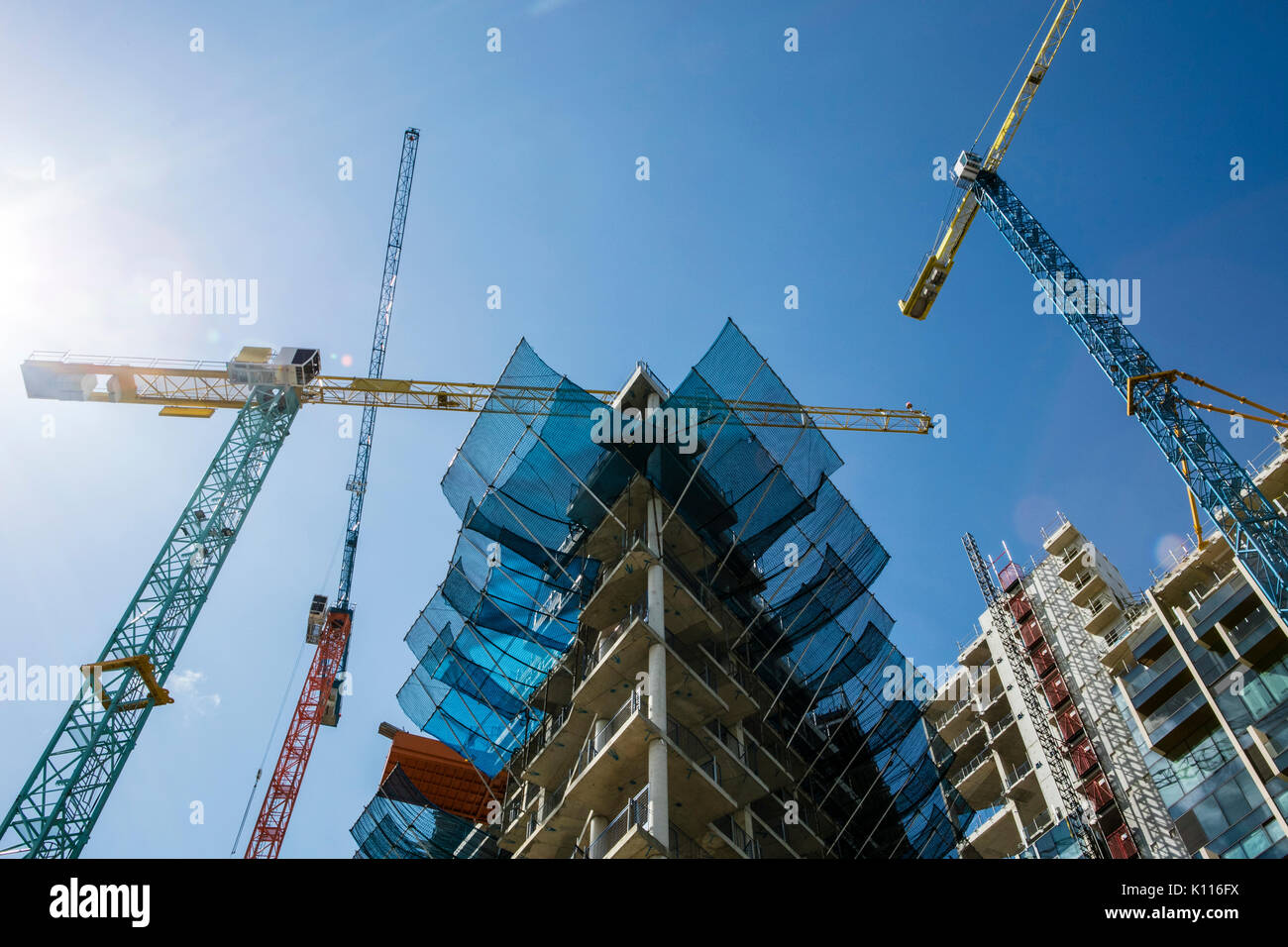 Cranes Building houseing Stock Photo