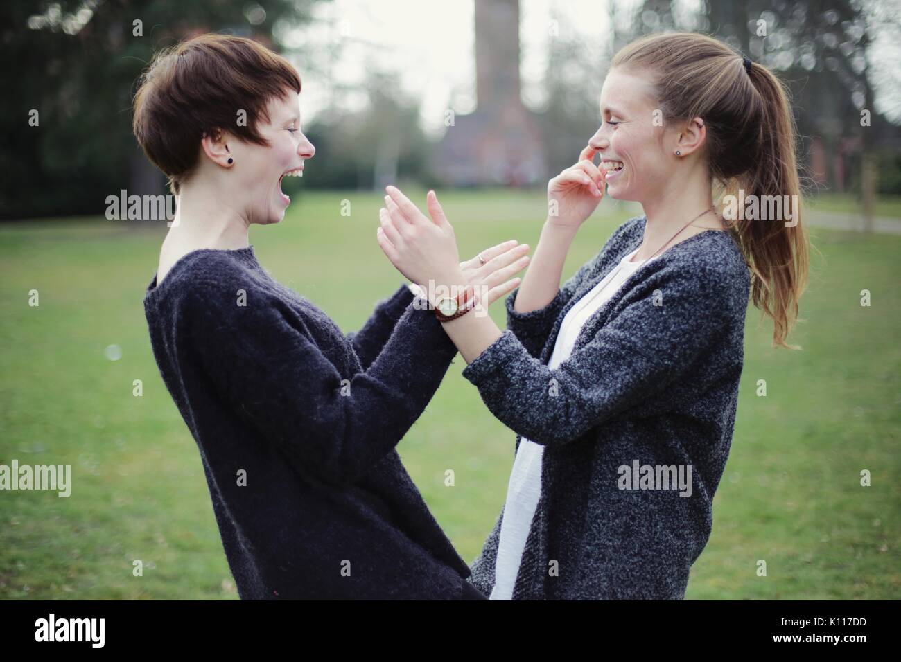 Two friends laughing hearty Stock Photo