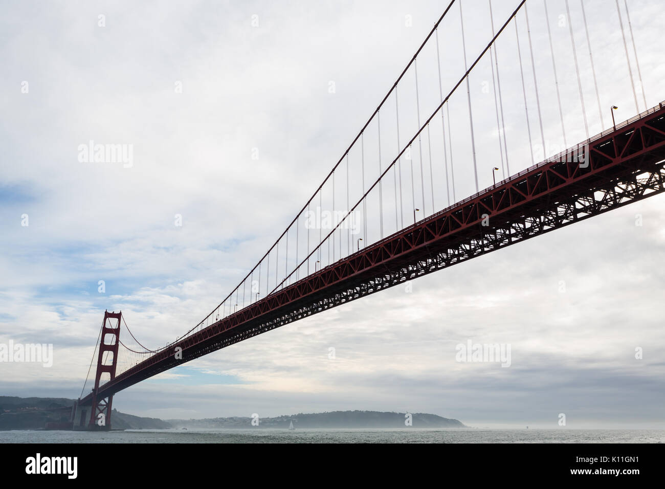 Fog begins to encroach on the long span of the Golden Gate Bridge Stock Photo