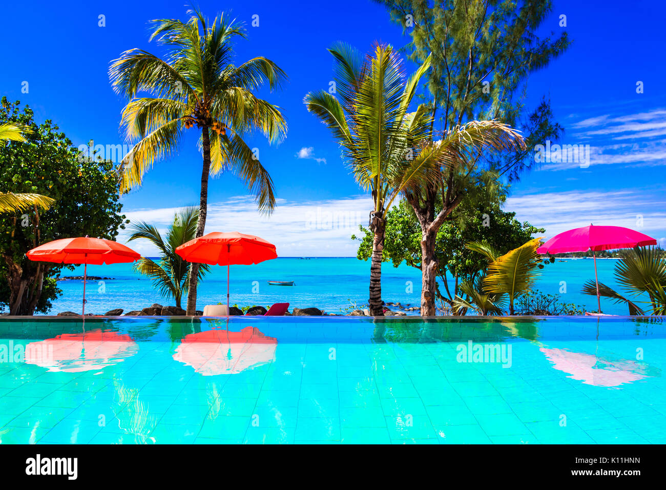 luxury vacation in Mauritius island. swim pool and lounge bar Stock Photo