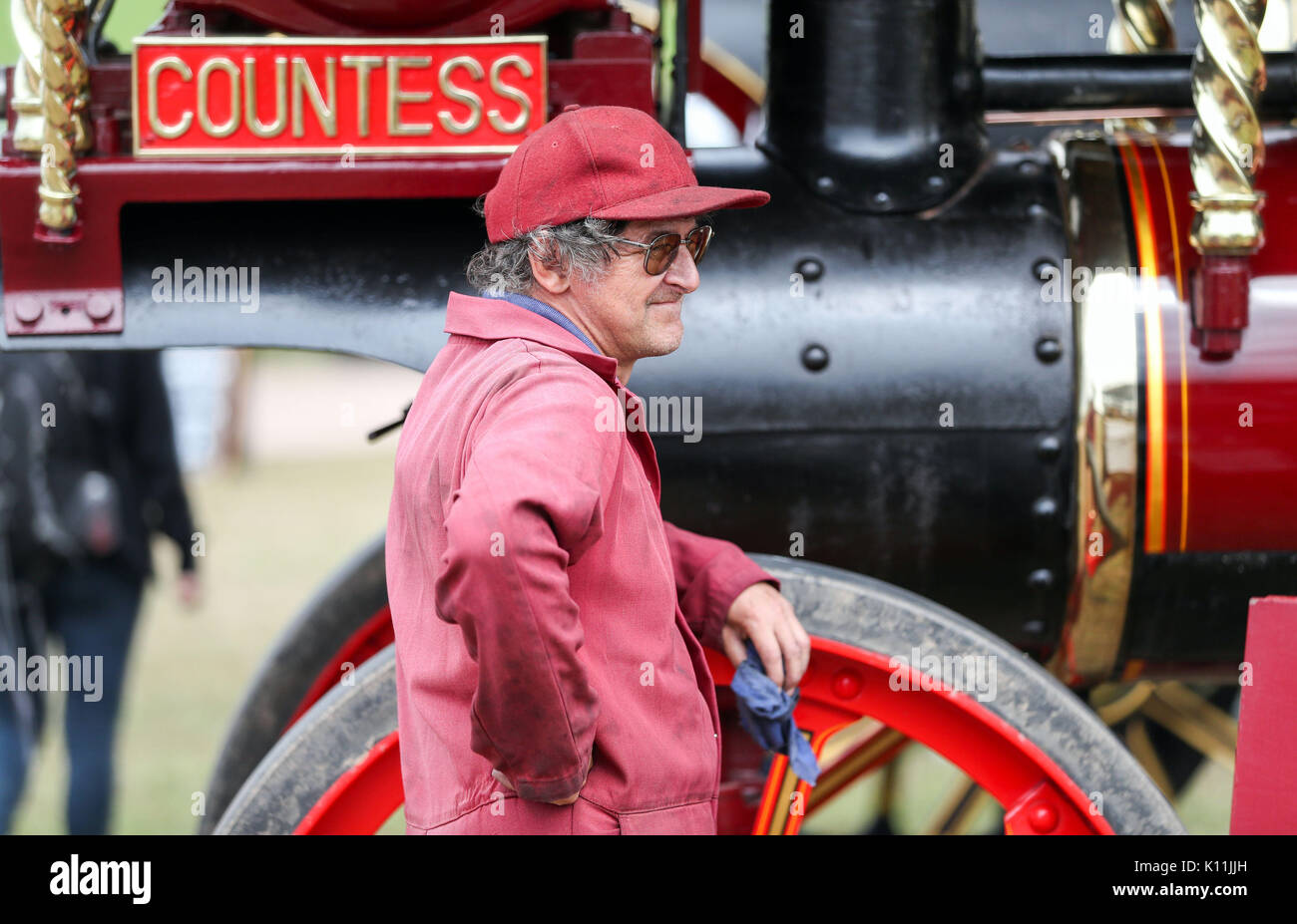 An exhibitor stands next the Garrett Showman traction engine 'Countess ...