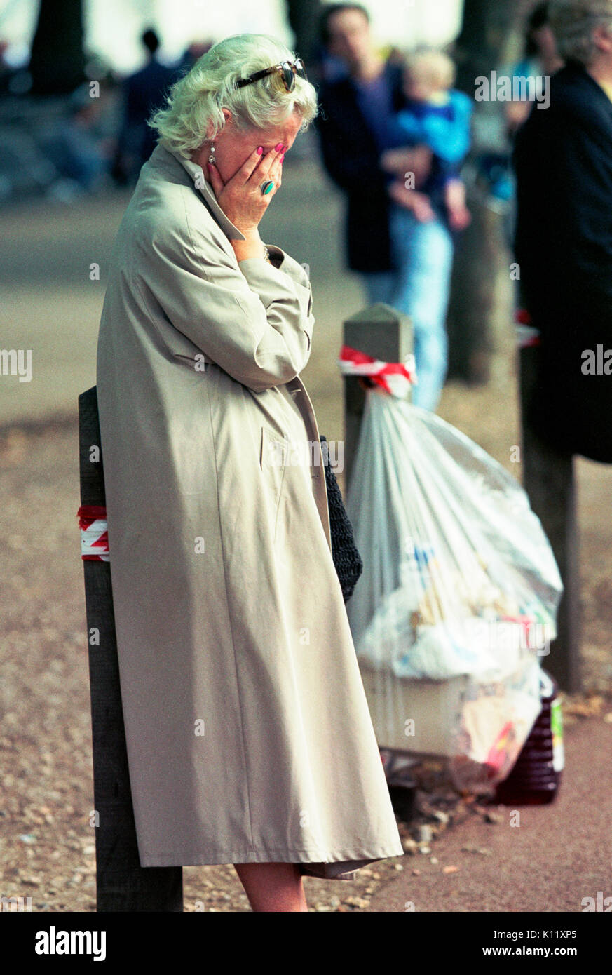 London, UK, 6th September, 1997. Funeral of Diana, Princess of Wales. A grieving woman is pictured in the Mall after having watched  Princess Diana's funeral cortege pass by. Stock Photo