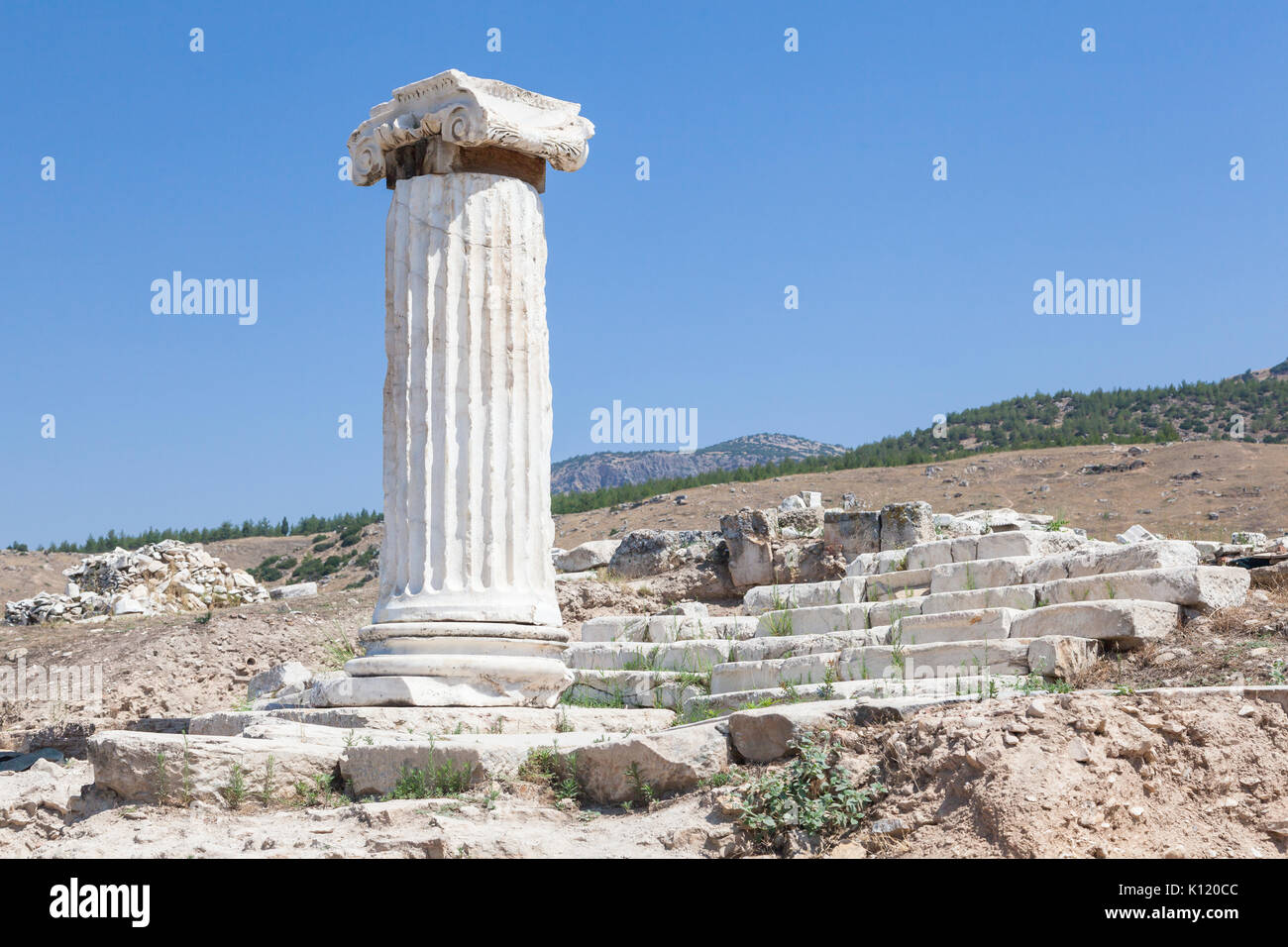 Marble column and Ruins of the ancient city of Hierapolis in the vicinity of Pamukkale, Turkey Stock Photo