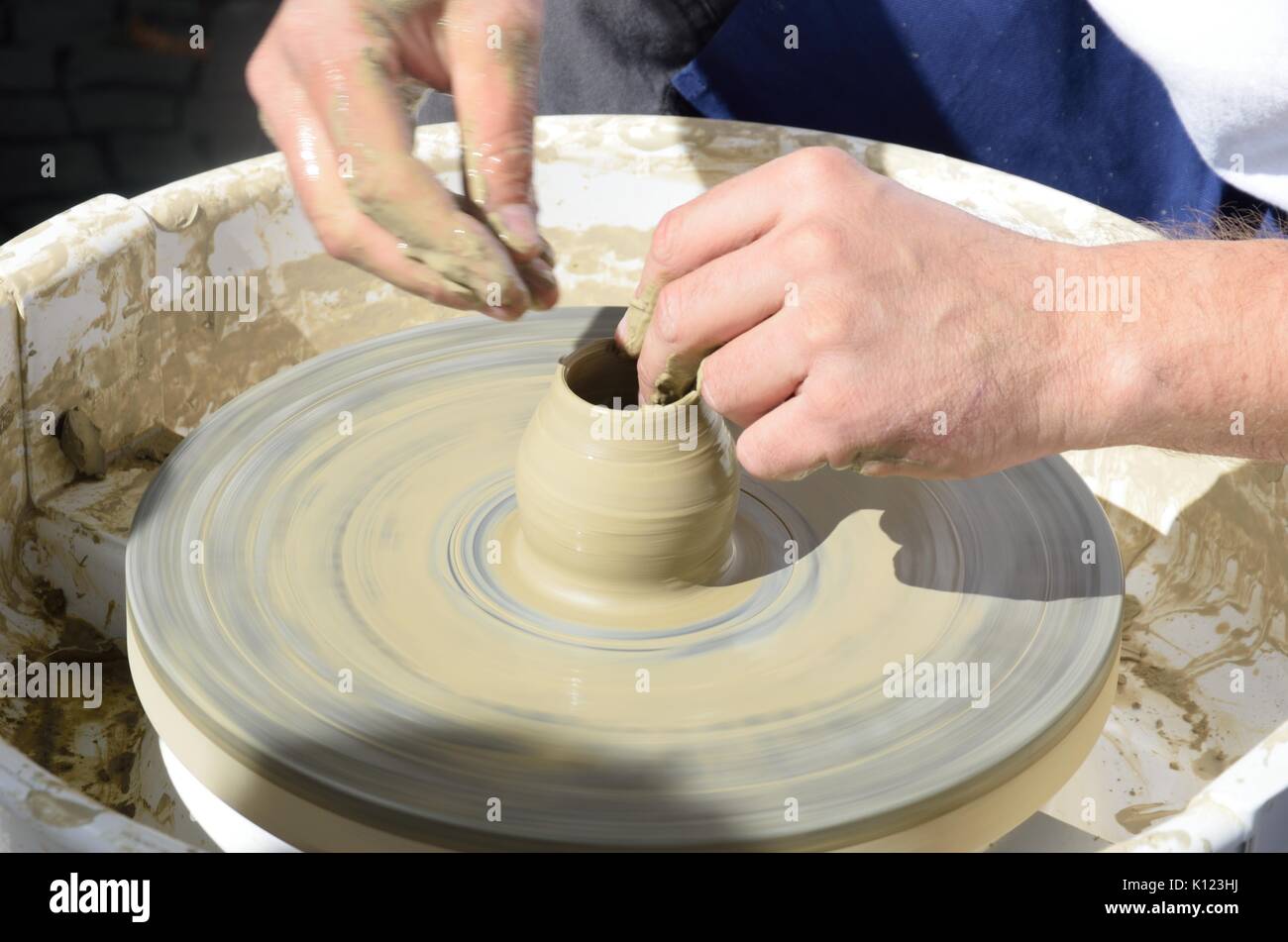 Pot being made on potting wheel Stock Photo - Alamy