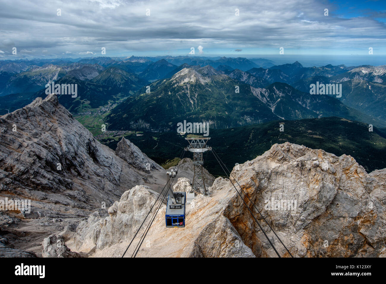 The Tyrolean Zugspitze Cable Car arrives at the summit of the Zugspitze mountain on the German-Austrian border. Stock Photo