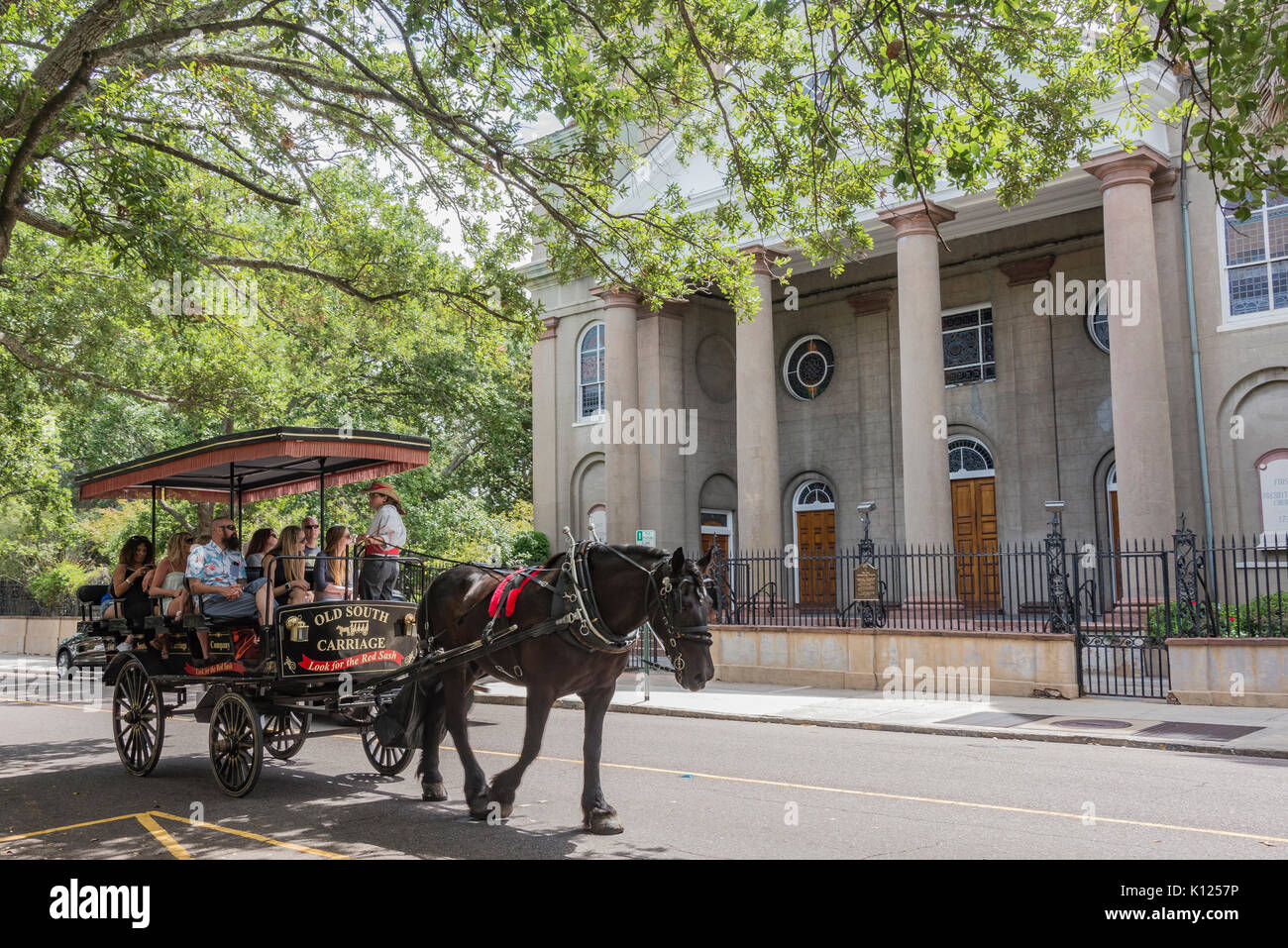 America, South Carolina, Charleston, horsedrawn carriage passing by the First Presbyteran Church in historic downtown Stock Photo