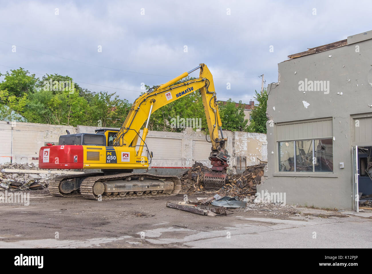 Heavy equipment demolishes and old building in downtown Orillia Ontario