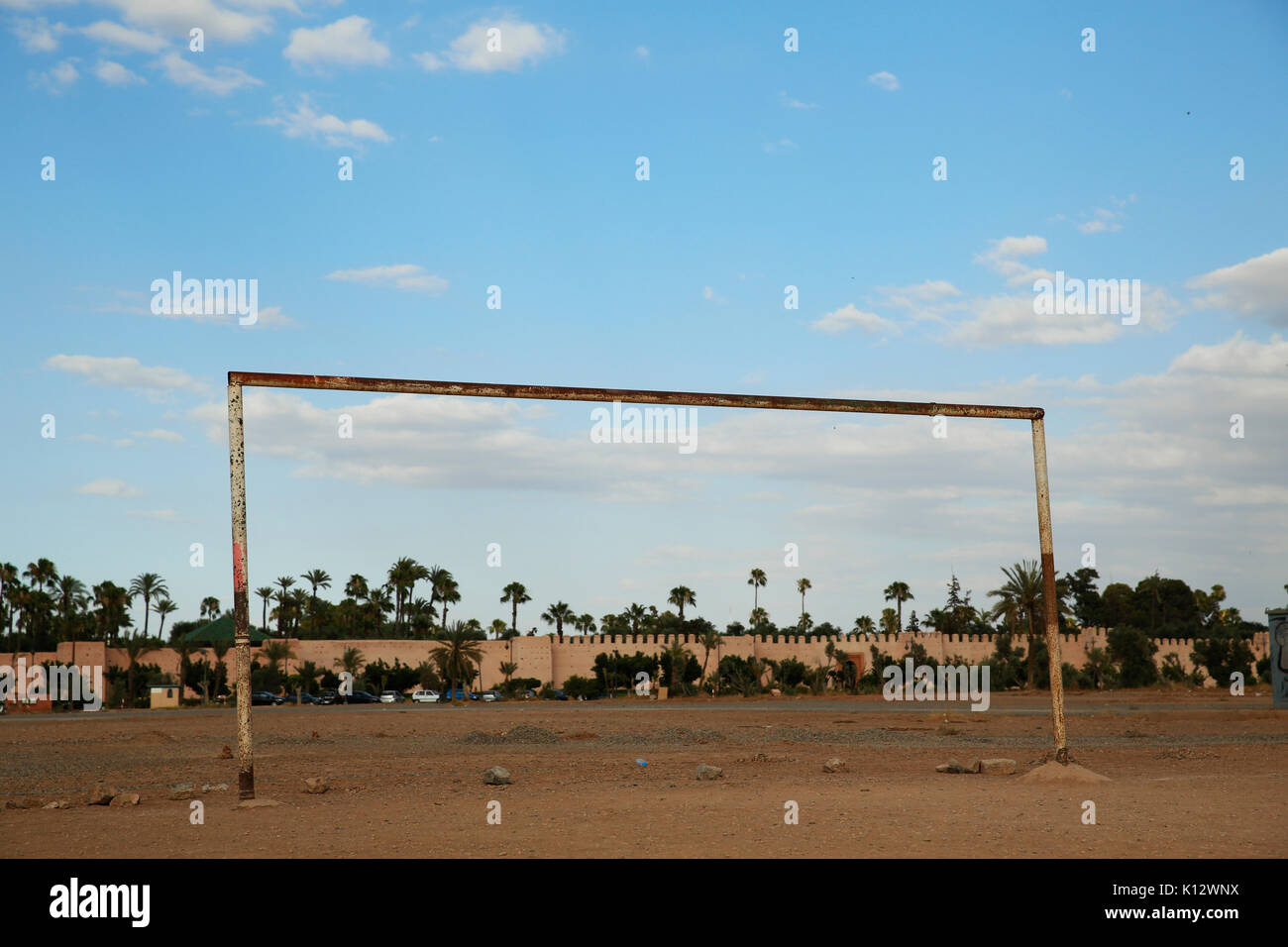A goal post is pictured on a sandy football pitch outside the walls of the medina at Marrakech in Morocco.  Photograph : © Luke MacGregor +44 (0) 79 7 Stock Photo