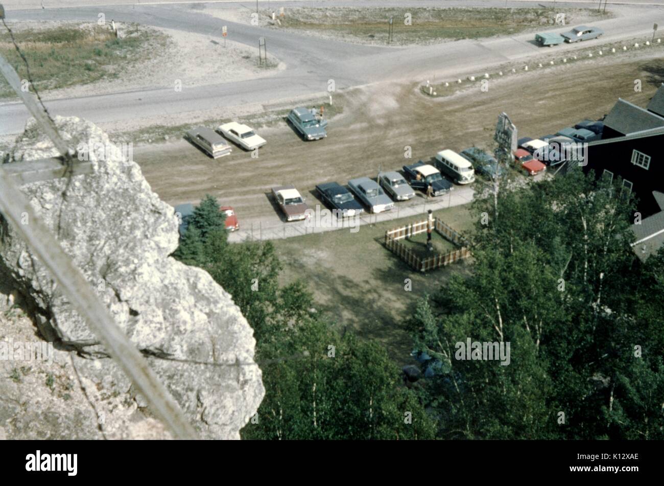 Aerial view of cars in parking lot at a roadside attraction near Castle