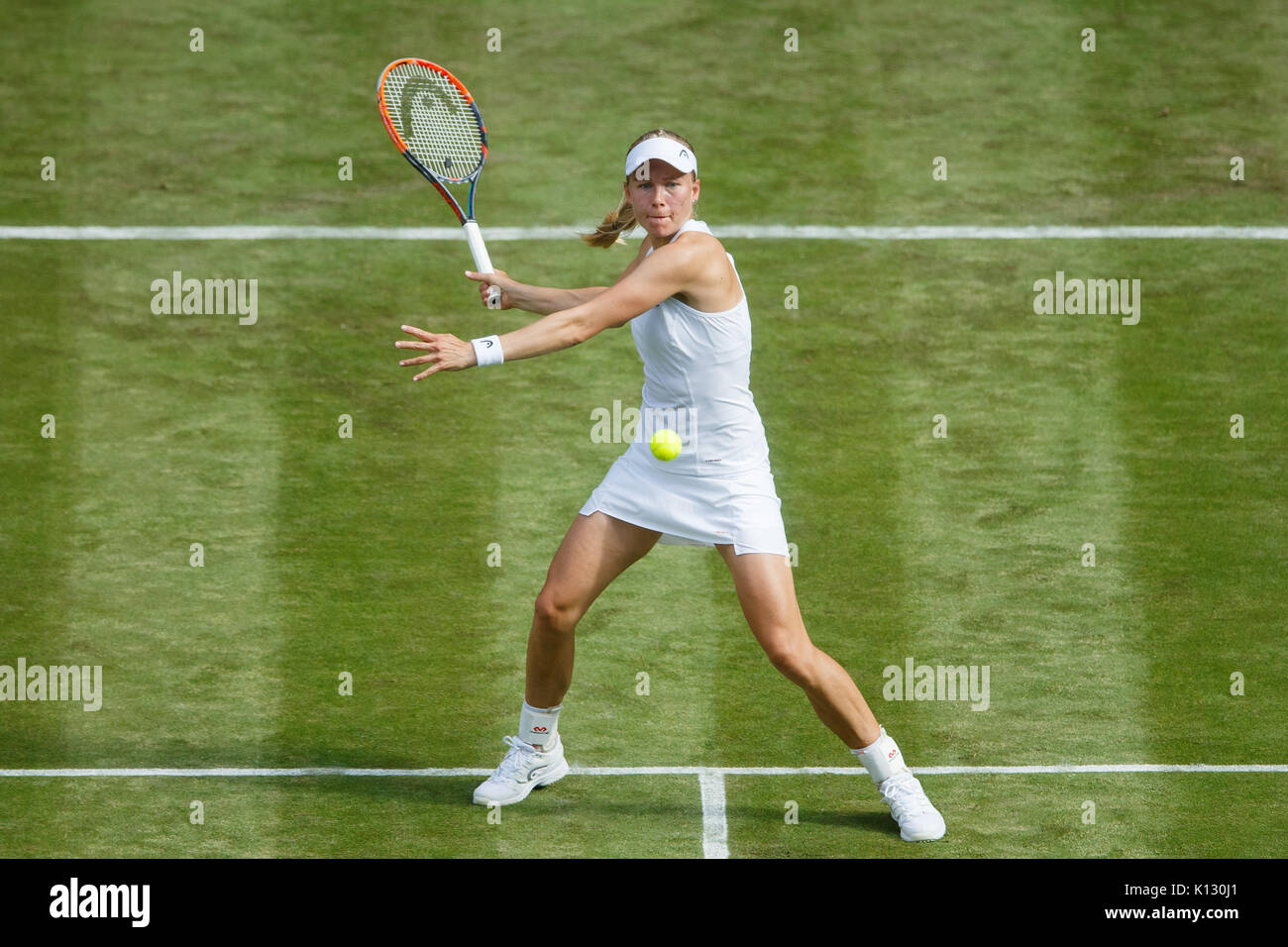 Johanna Larsson in action against Petra Kvitova at the Ladies' Singles