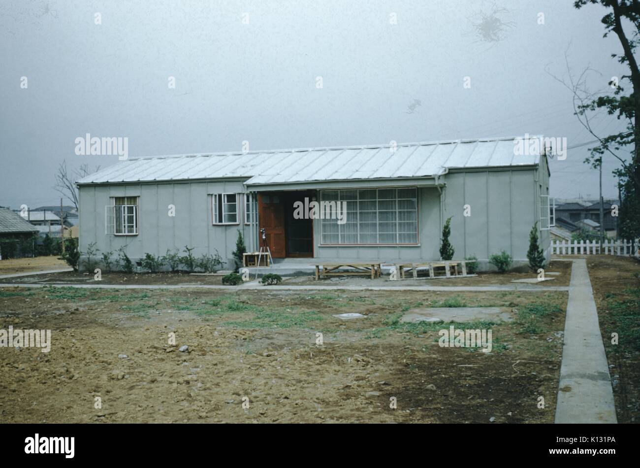 Ranch style home with path and trees, on an overcast day, at the Wesleyan Methodist Mission Compound, Japan, 1952. Stock Photo