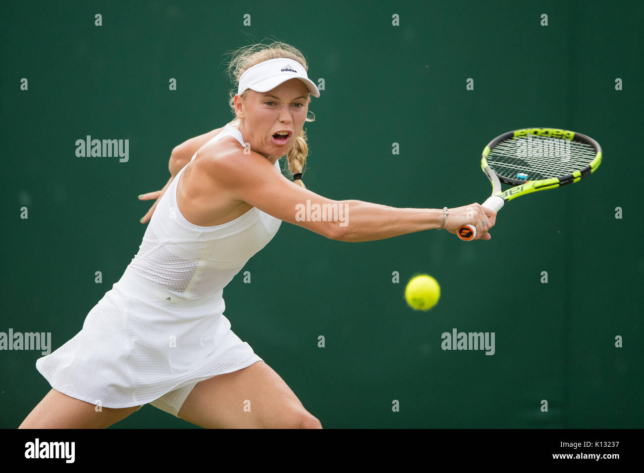 Caroline Wozniacki of Denmark in action at the Ladies' Singles - Wimbledon Championships 2017 Stock Photo