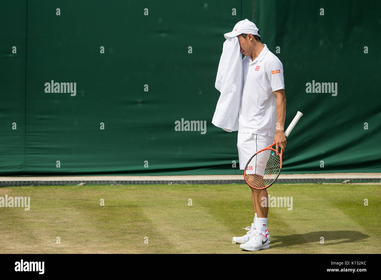 Kei Nishikori of Japan looks dejected at the Gentlemen's Singles - Wimbledon Championships 2017 Stock Photo