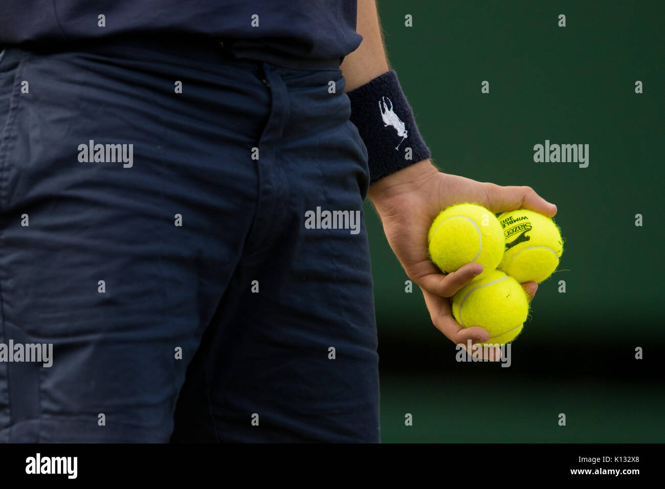 A ball boy collects balls at the Wimbledon Championships 2017 Stock