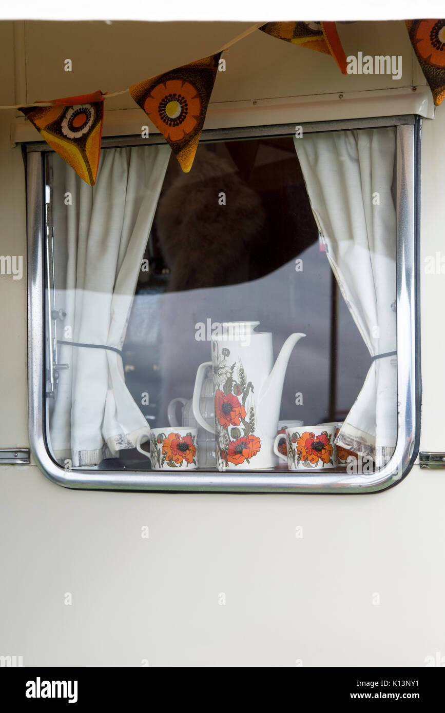 1970s coffee pot and cups in a vintage caravan at a vintage retro festival. UK Stock Photo