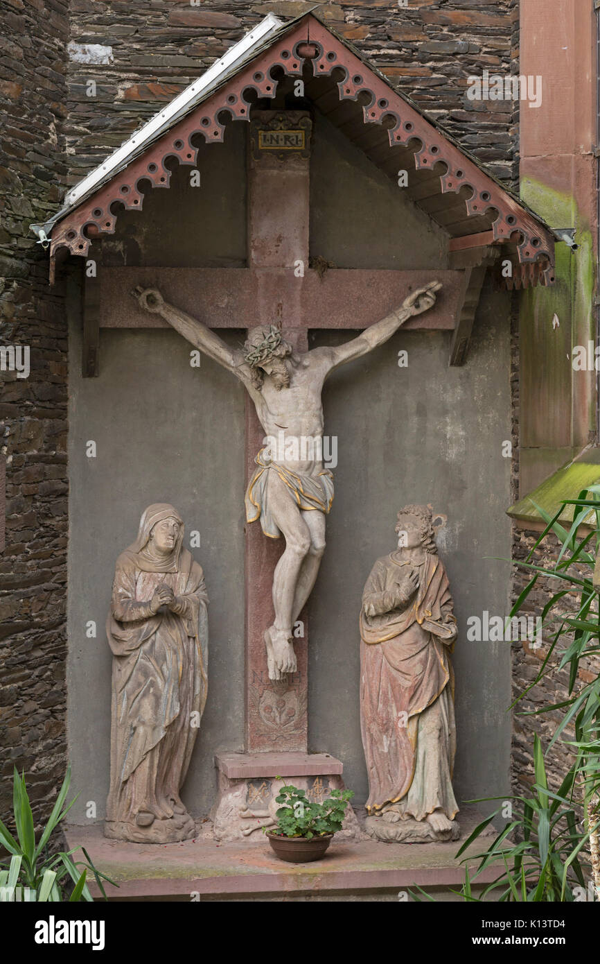 crucifix beside the church wall, Uerzig, Moselle, Rhineland-Palatinate, Germany Stock Photo