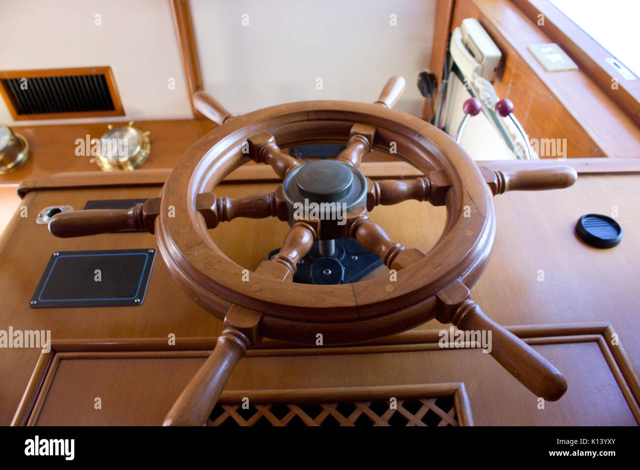 a ship's wooden steering wheel or helm Stock Photo