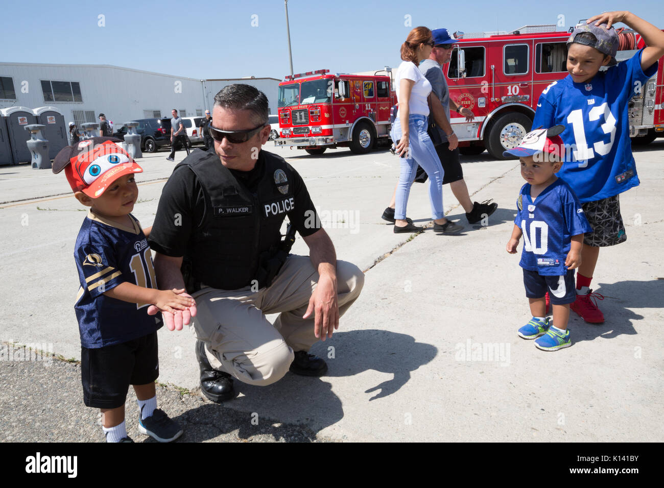August 19, 2017 - A police officer talks with children at the Special ...