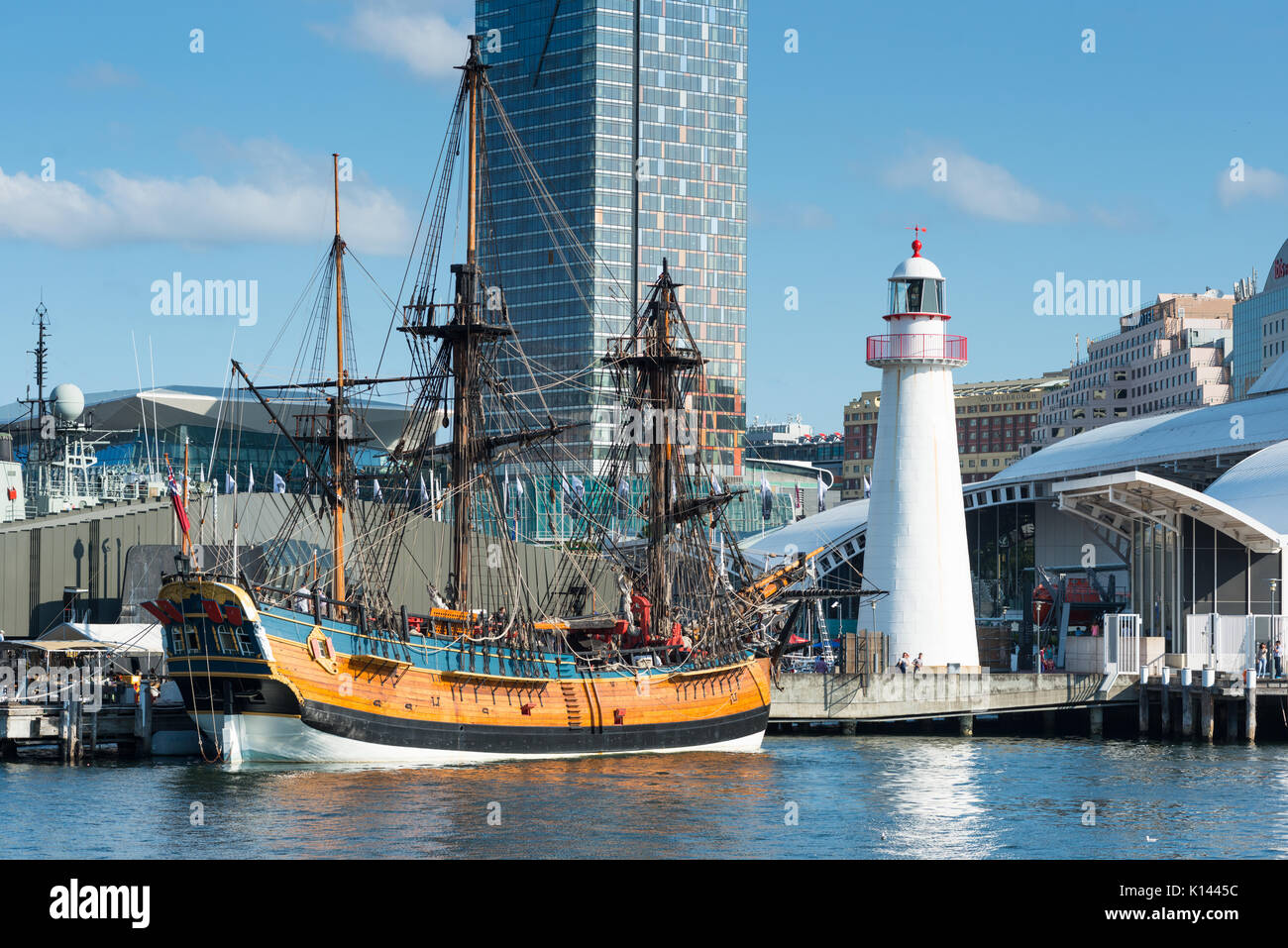 A replica of James Cook's HMS Endeavour, moored alongside the Australian National Maritime Museum in Darling Harbour, Sydney. Stock Photo