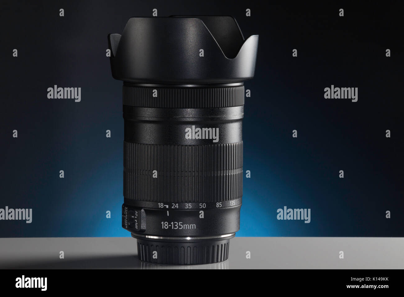 A Modern Telephoto Zoom lens with lens hood attached Stock Photo