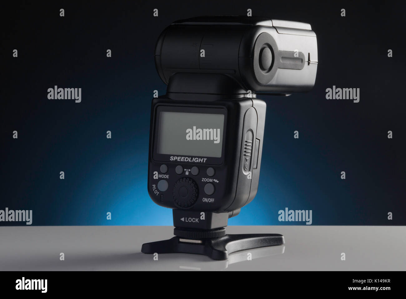 A Modern portable speed light showing its LCD screen Stock Photo
