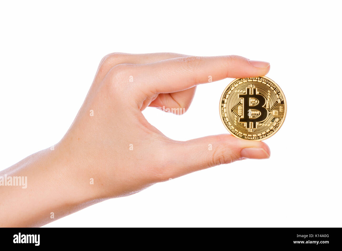 Young girl hand holding bitcoin on white background Stock Photo